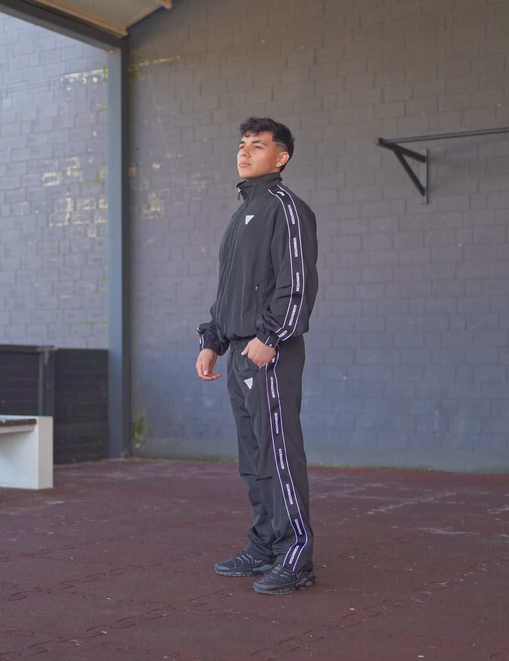 GORNATION athlete wearing the GORNATION tracksuite in black