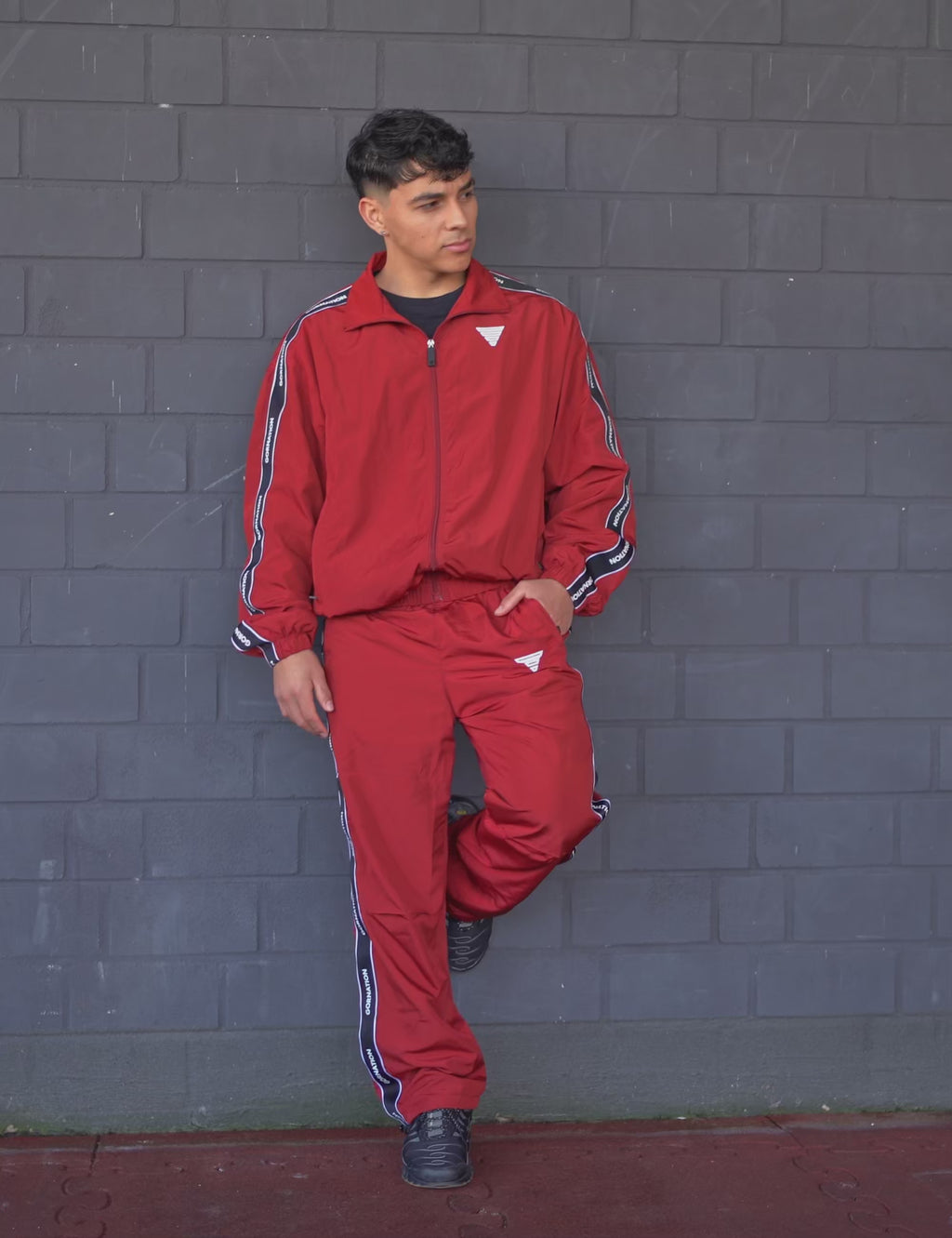 GORNATION athlete wearing the GORNATION tracksuite in red